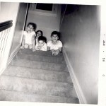 four kids top of stairs