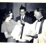 Greg Irene baptising baby